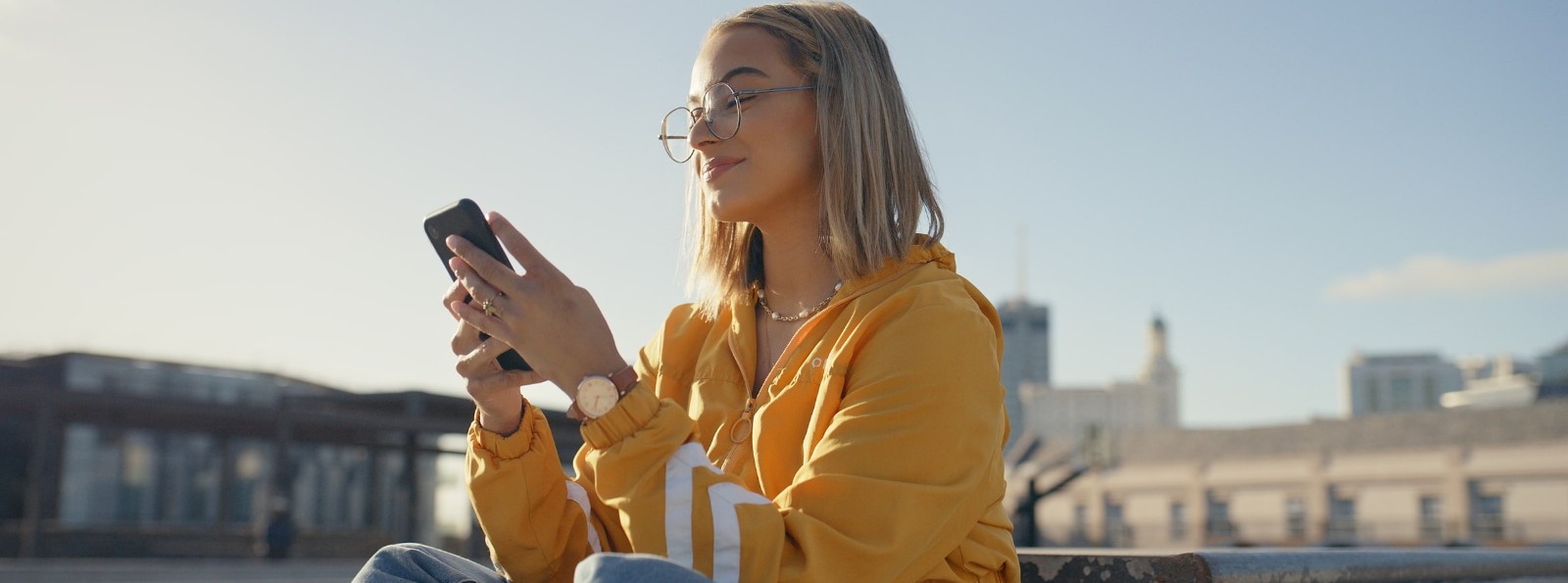 a woman looking at her mobile phone